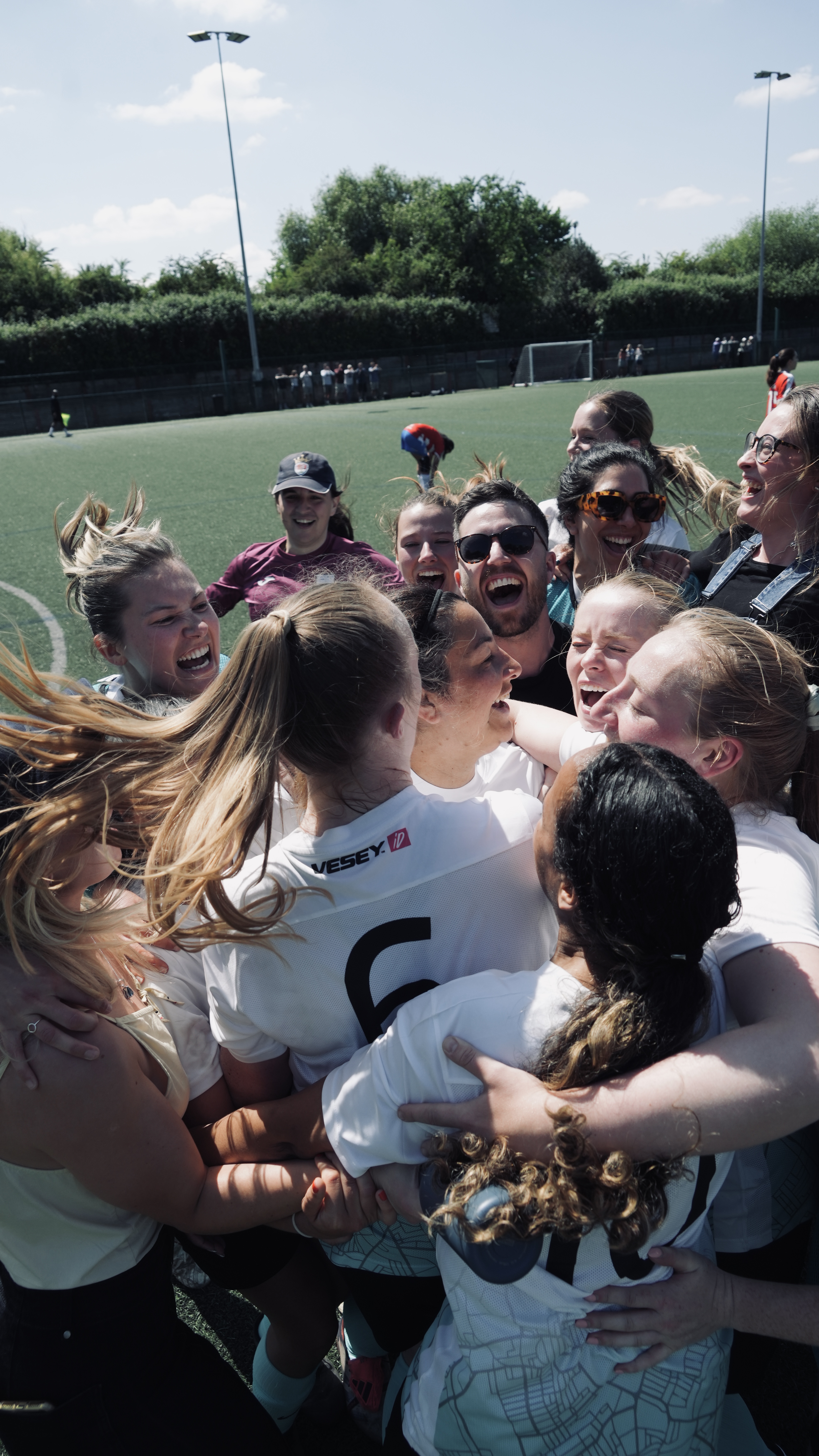 South West Saints players and supporters celebrate together after the club’s cup win