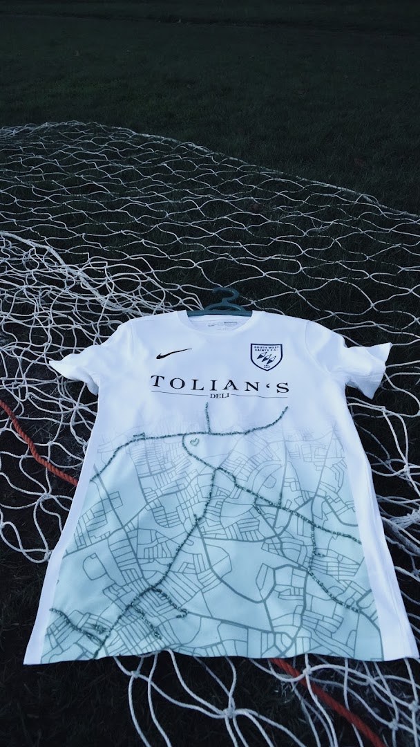The South West Saints map-print home shirt displayed against a goal net