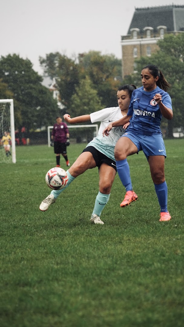 A Saints player competes for the ball during a match